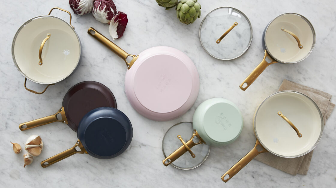 image of an overhead view of pans laid out on a marble counter so that you can see their colors in full display.