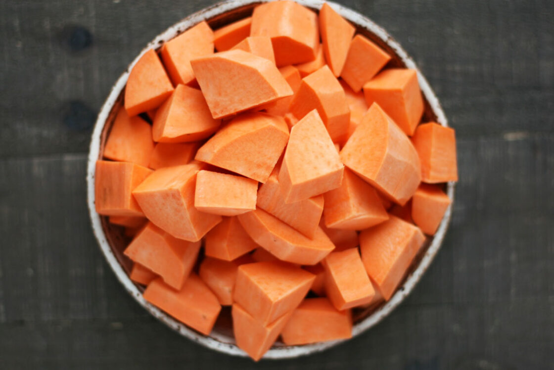 Image of fresh, cubed sweet potato to be used for sweet potato casserole.