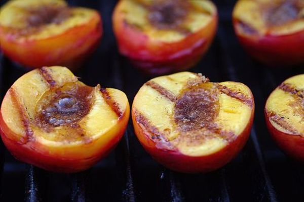 image of peaches on the grill with grill marks for grilled peach salad.