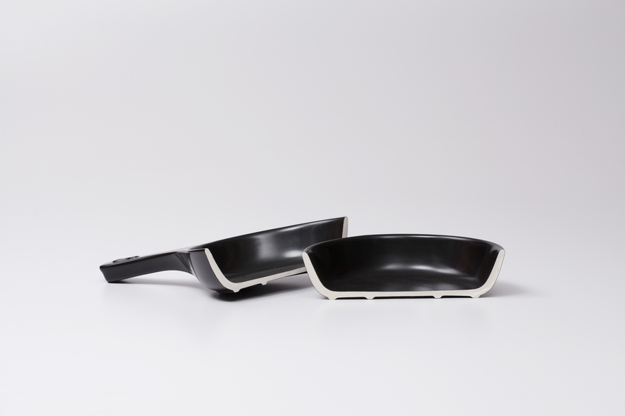 Image of a 7-inch Xtrema Cookware skillet broken in half to showcase the 100% pure ceramic interior.