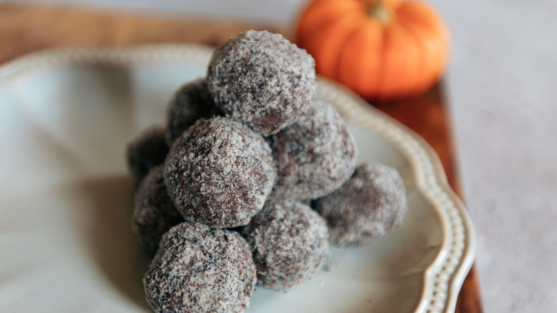 image of no bake pumpkin balls on a white plate