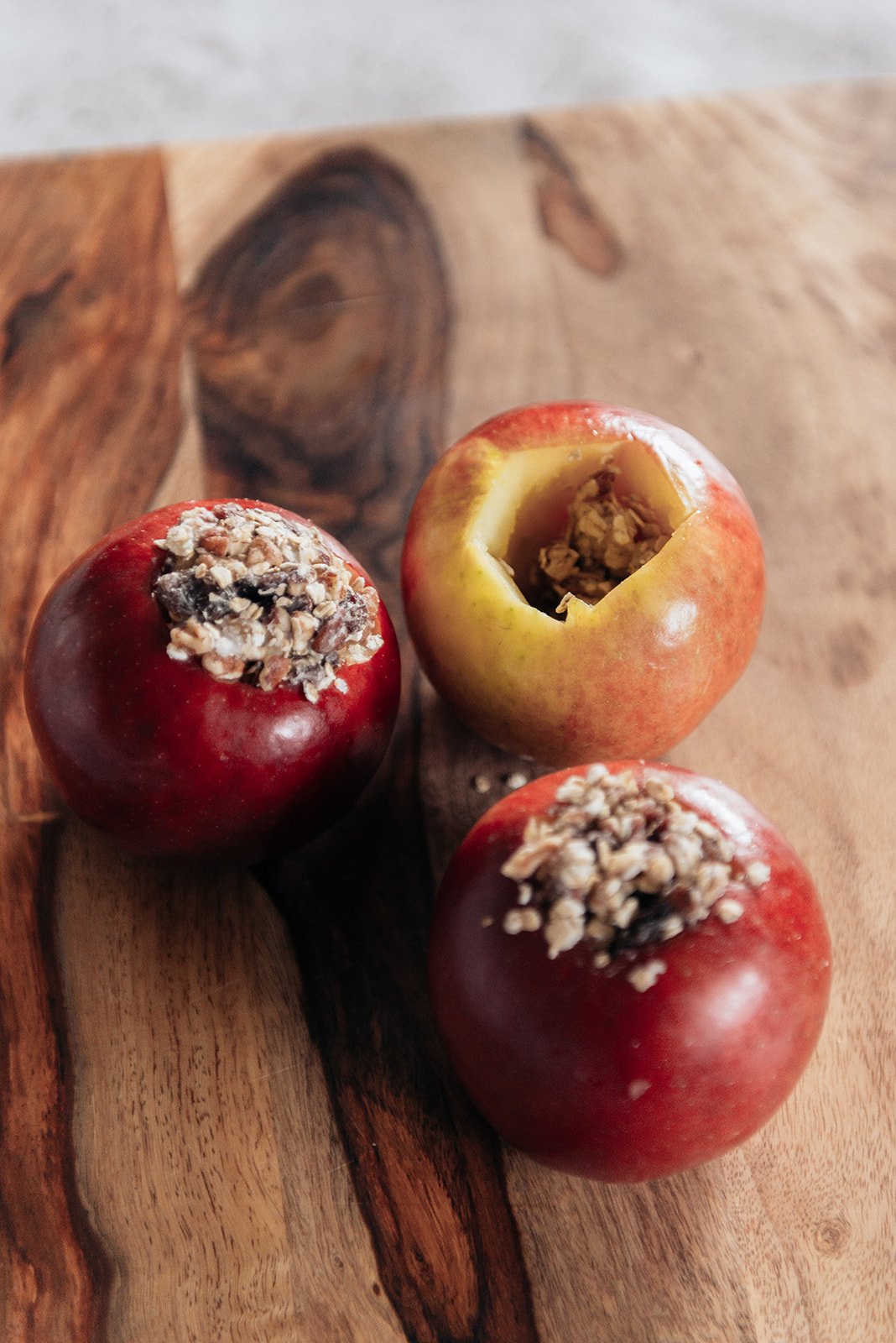 image of three cored apples filled with cinnamon spice mixture for the baked apple recipe