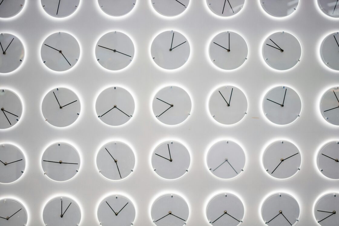 image of many clocks backlit in white showing different times that correspond to our circadian rhythms