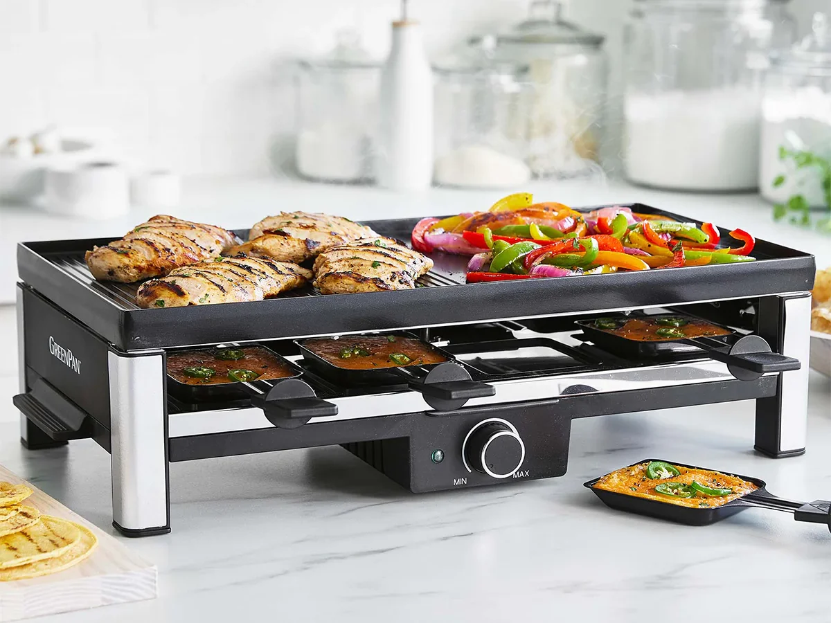 image of a large griddle GreenPan small appliance loaded up with food.