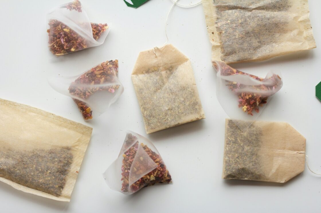 Image of various tea bags laid out flat against a white background.